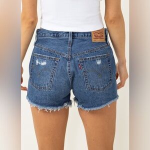 Levi’s 501 high waist lightly distressed medium wash jean shorts. Women size 28.